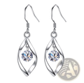 Twisted teardrop silver earrings with a twisted wire design featuring a clear faceted crystal centerpiece