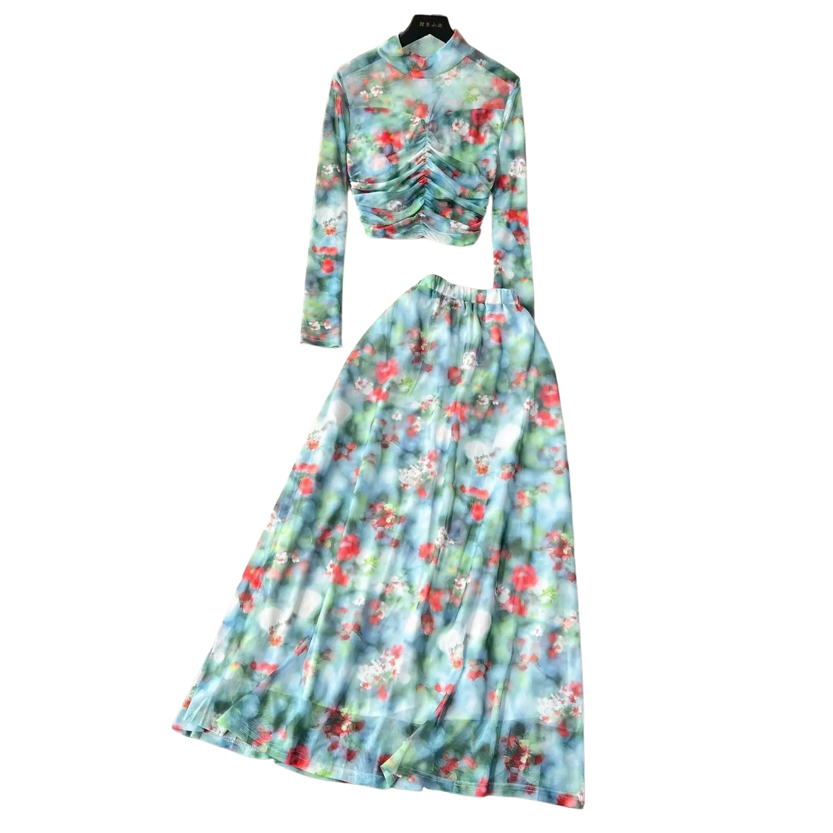 A two-piece mesh skirt set with marble print in soft blue green and red featuring an elastic closure type