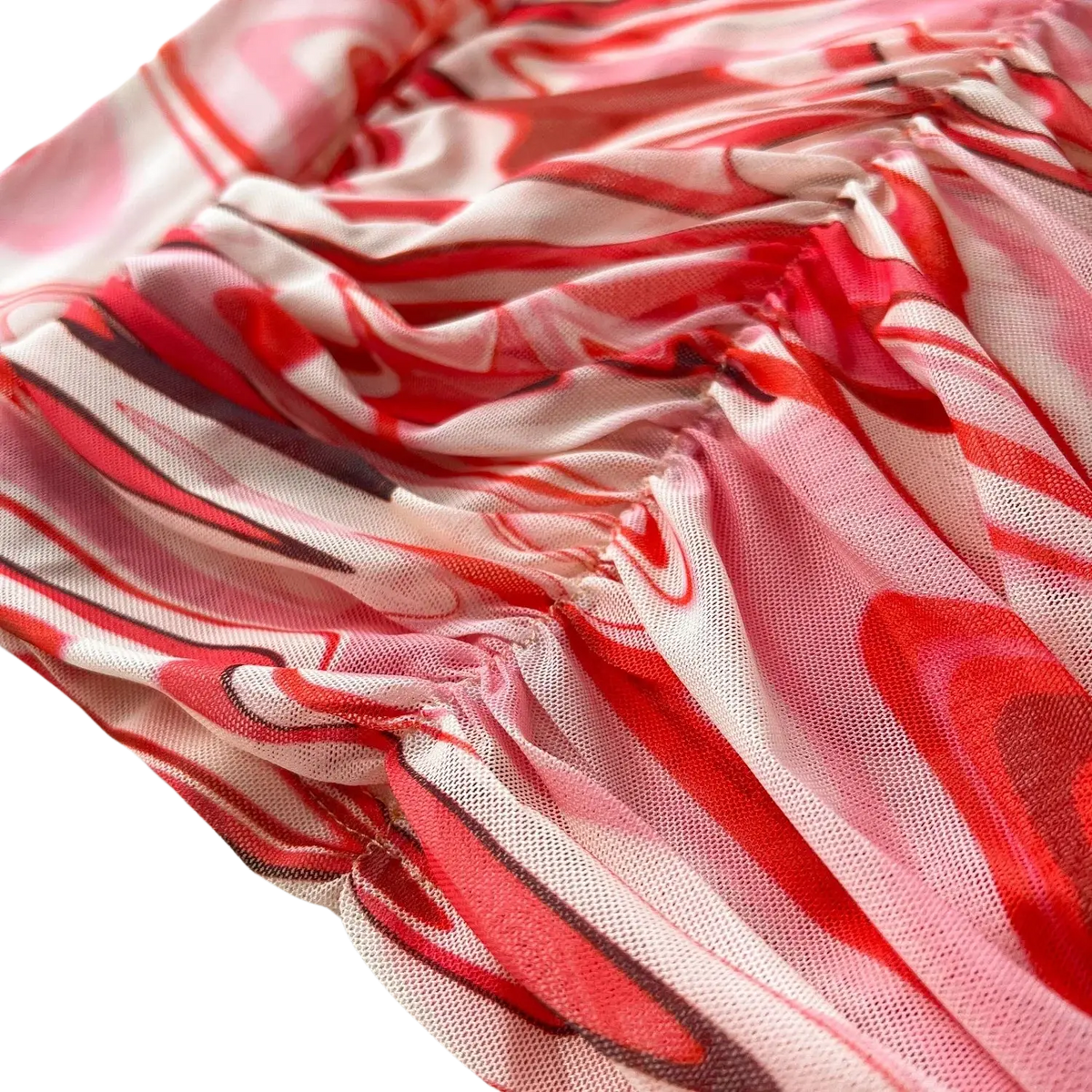 A two piece mesh skirt set with a flowing semi-transparent dress in red and pink marble print with elastic closure