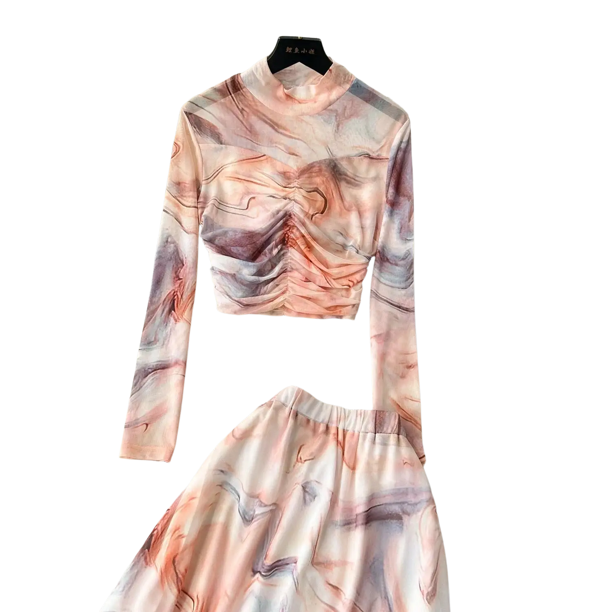 A soft long-sleeved high-neck top with ruched front and marble print in blush pink mauve and gray with elastic closure