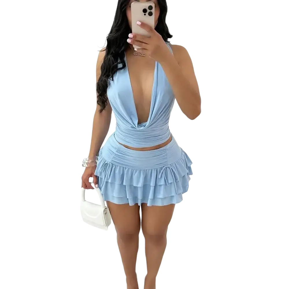 Light blue ruched two-piece mini skirt set with pullover closure and plunging neckline featuring a tiered skirt