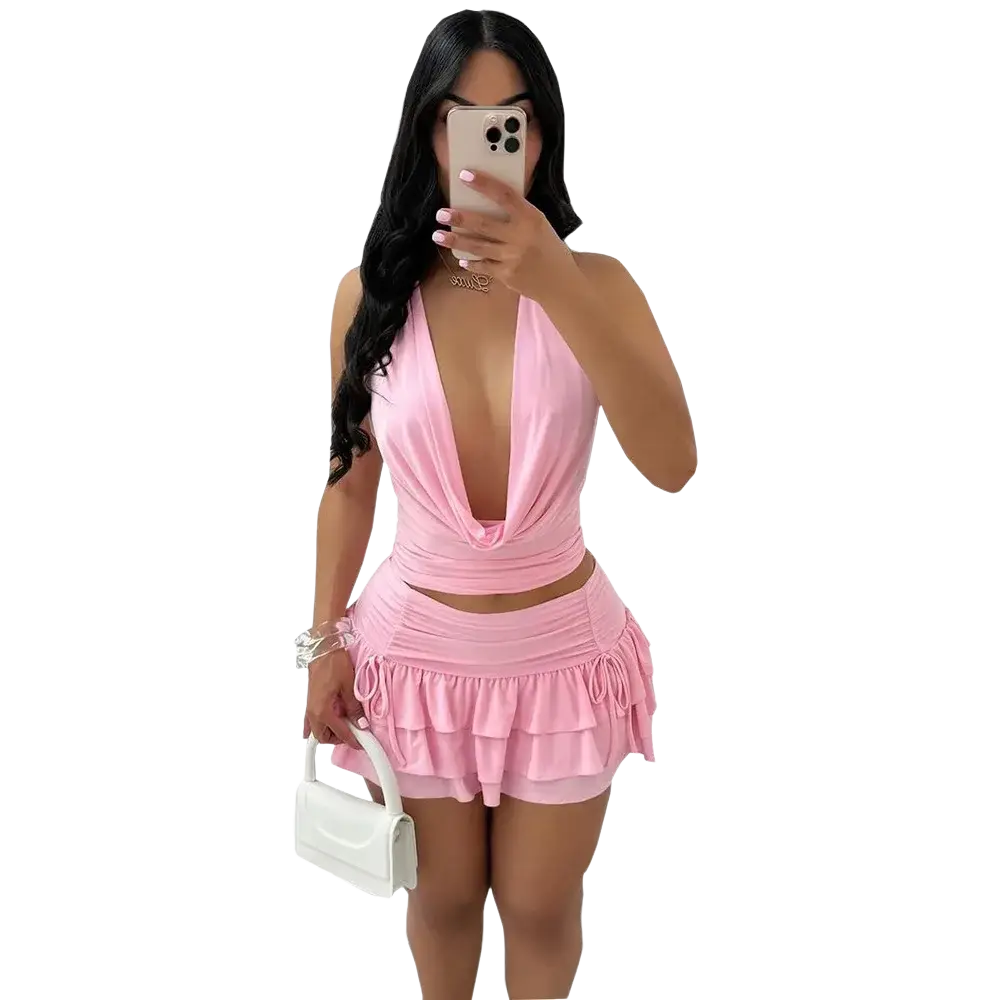 Pink halter-neck two piece mini skirt set with ruffled skirt and pullover closure type for stylish wear