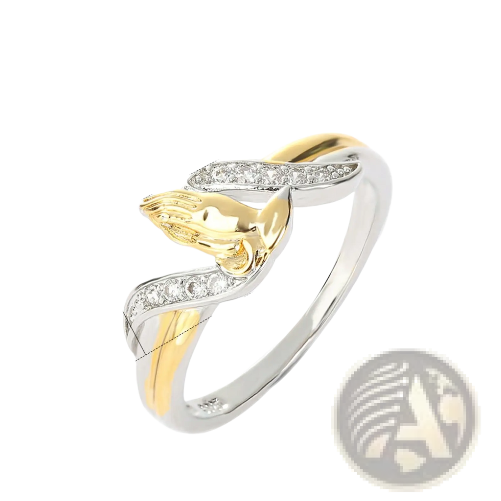 A two tone 18k gold praying hands ring with gold and silver band and cubic zirconia detailing