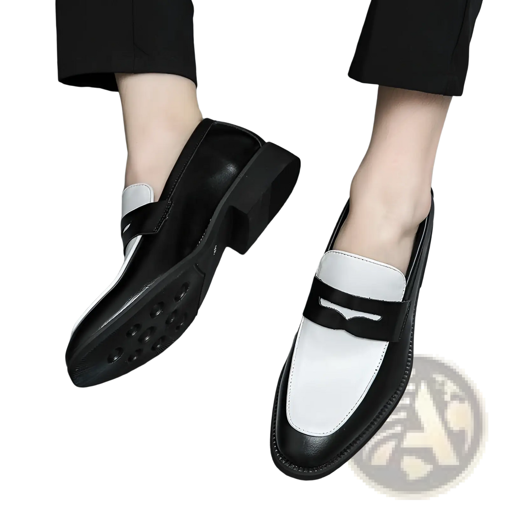 Two-tone black and white leather loafers with glossy finish and contrasting stitching for casual slip-on wear