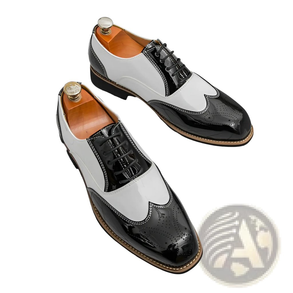 Two-tone men’s patent leather brogue oxford shoes in black and white with glossy uppers shown from the back side