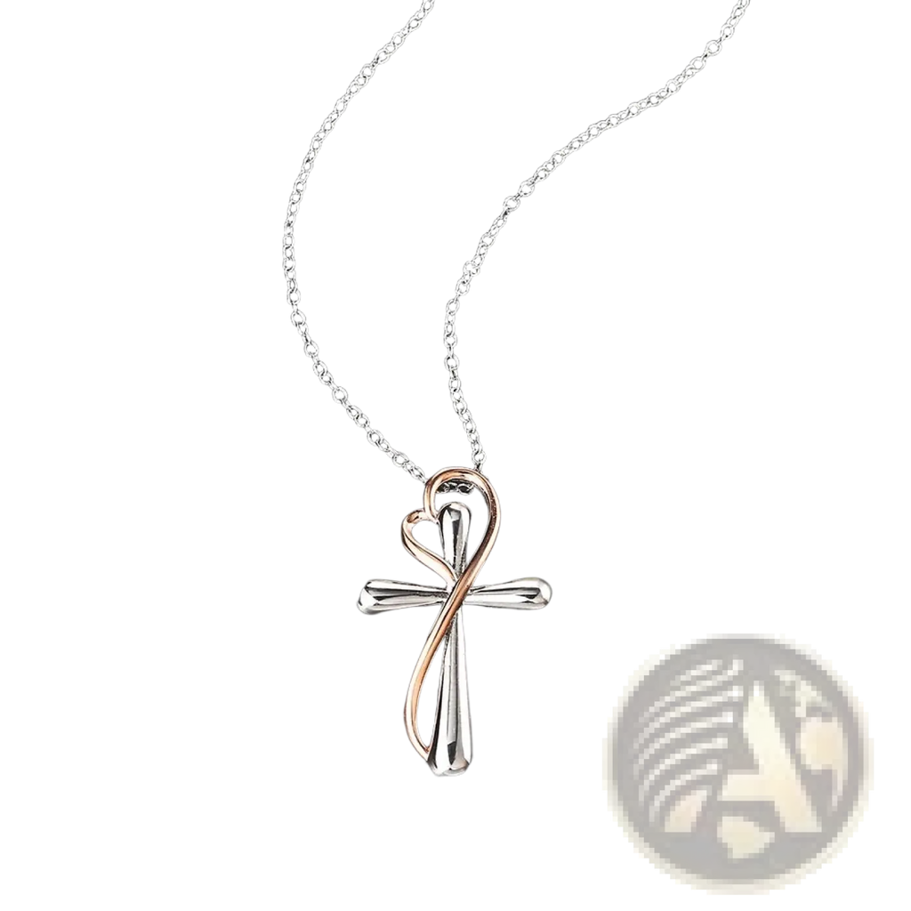 Two tone silver and rose gold cross pendant with heart shaped design hanging from delicate chain in necklace
