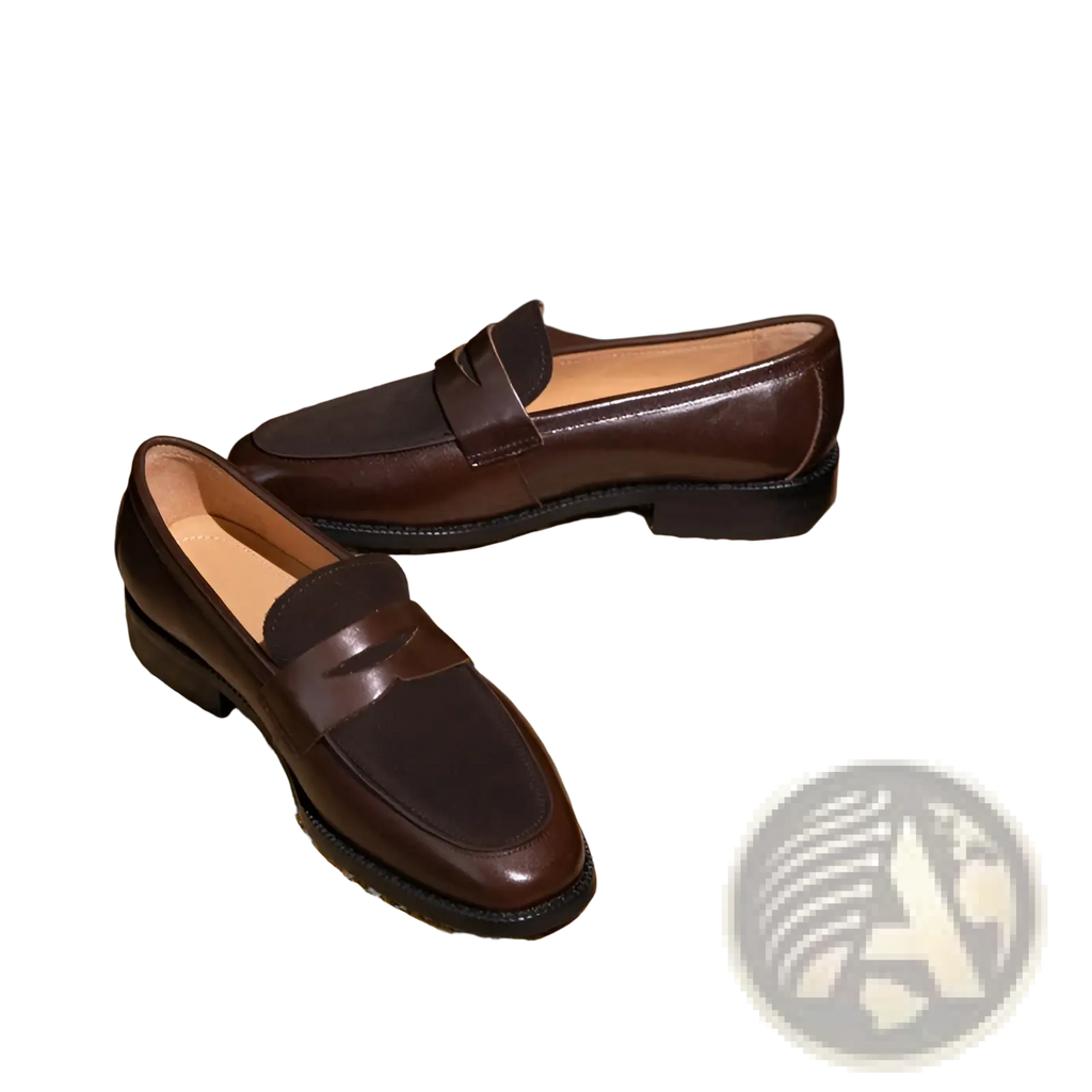 Brown two tone leather loafers with a classic slip-on design and single strap across the toe in square toe style
