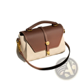 Two-tone woven leather crossbody handbag with brown flap cream body and gold-toned hardware accents