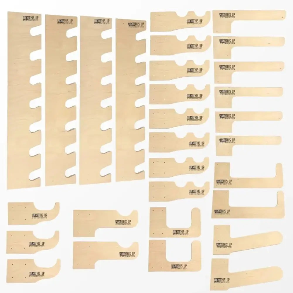 Set of light-colored wooden craft templates with cut-out shapes for ultimate garden tool wall organizer and storage kit