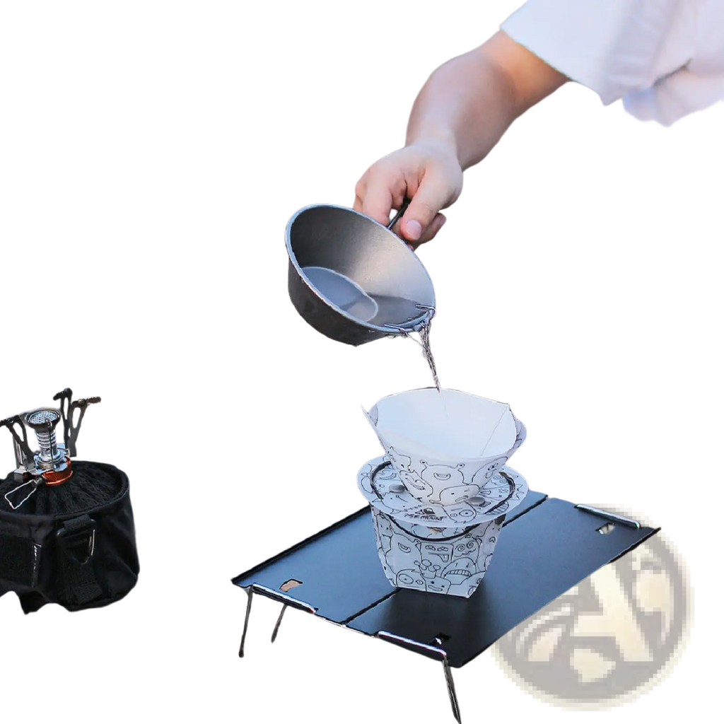 White paper coffee filter with black cartoon illustrations resting on matching filters on a portable metal tray