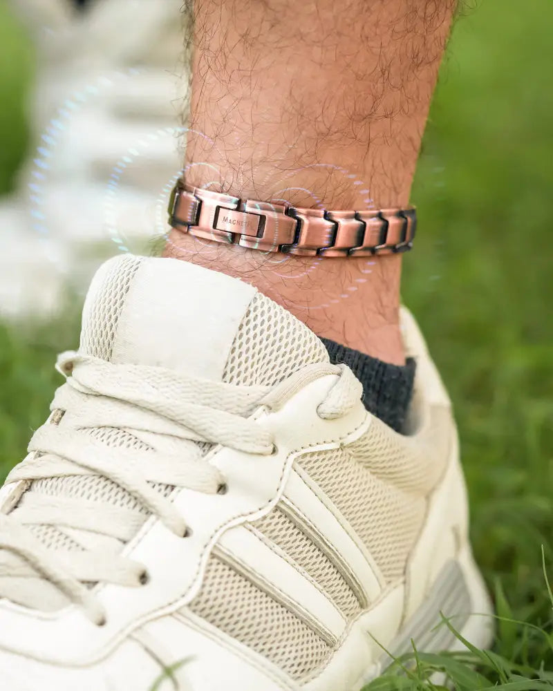 Copper-toned pure copper magnetic therapy anklet for men with sleek segmented design and engraved magnet branding