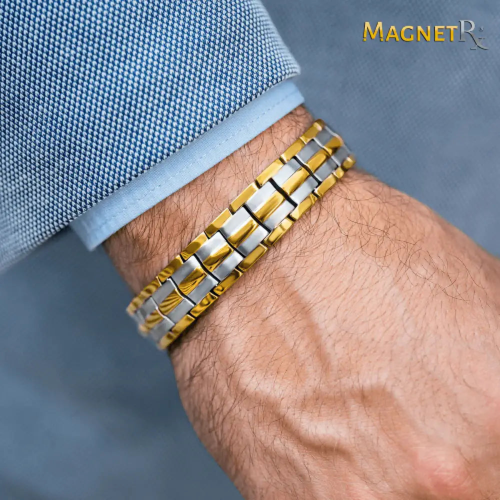 A sleek two-tone magnetrx ultra strength magnetic therapy bracelet with alternating gold and silver links worn on wrist