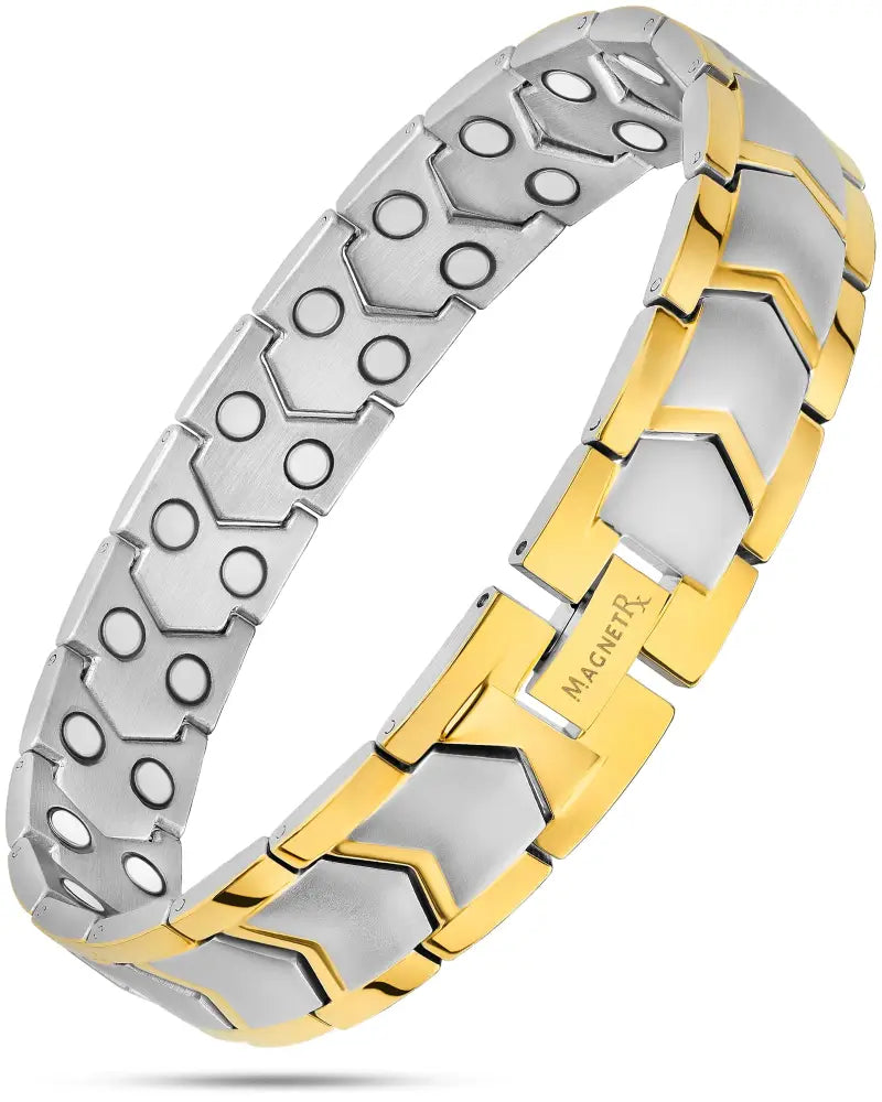 Two tone hexagonal magnetic therapy bracelet in stainless steel with silver and gold toned links featuring circular cutouts