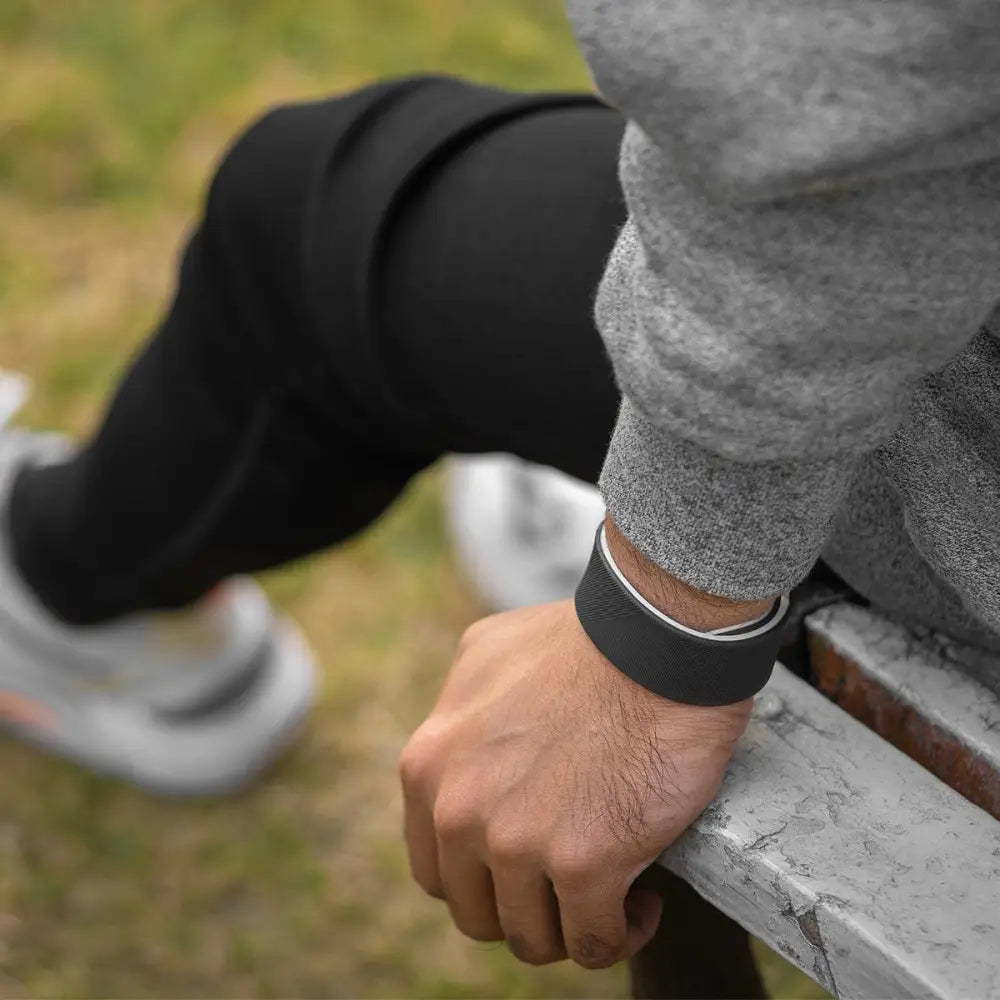 Ultra Strength magnetic silicone sports bracelet with black band, sleek minimalist design, and subtle white inner lining