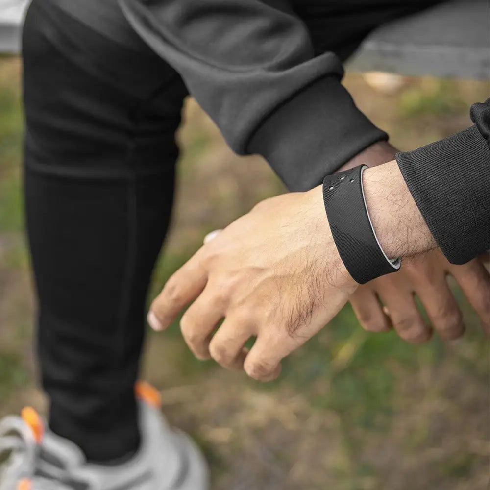 Black silicone ultra strength magnetic sports bracelet with sleek minimalist design and subtle silver accent trim