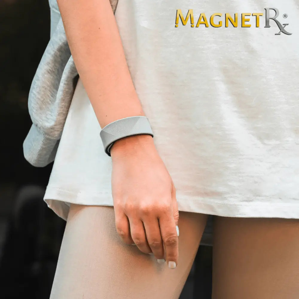 A sleek light gray neodymium magnetic sports bracelet with a modern geometric design for ultra strength use