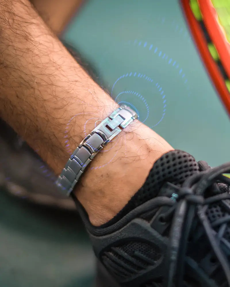 Men’s ultra strength silver titanium magnetic therapy anklet with a sleek segmented design worn on an ankle