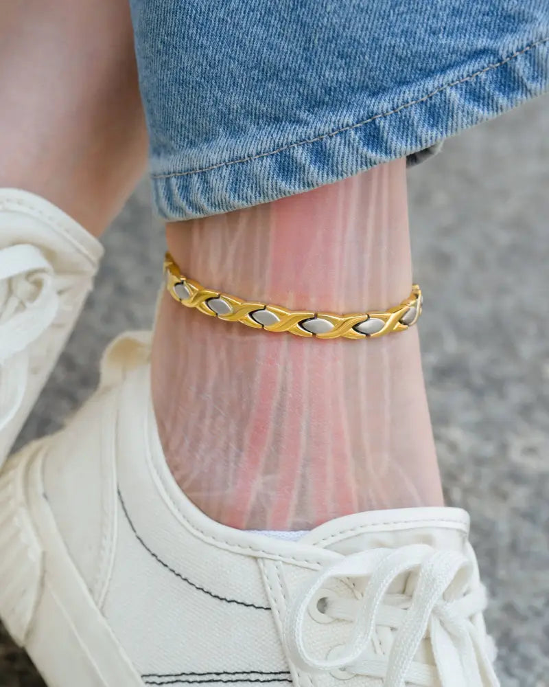 Two tone titanium magnetic therapy anklet with gold and silver-toned sleek interlocking chain and neodymium magnets