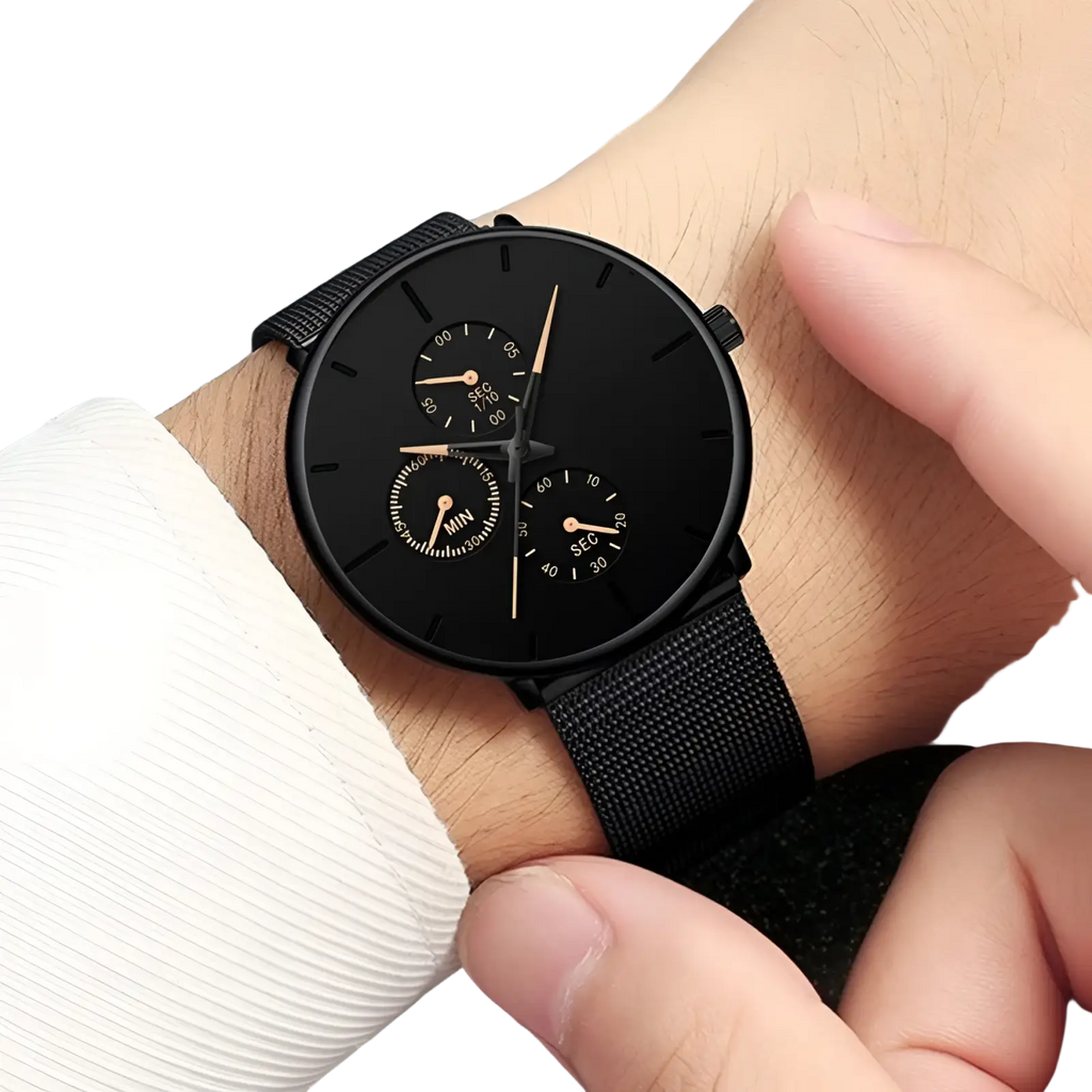 Ultra thin black mesh quartz watch for men featuring a black chronograph dial with gold-tone hands and mesh strap