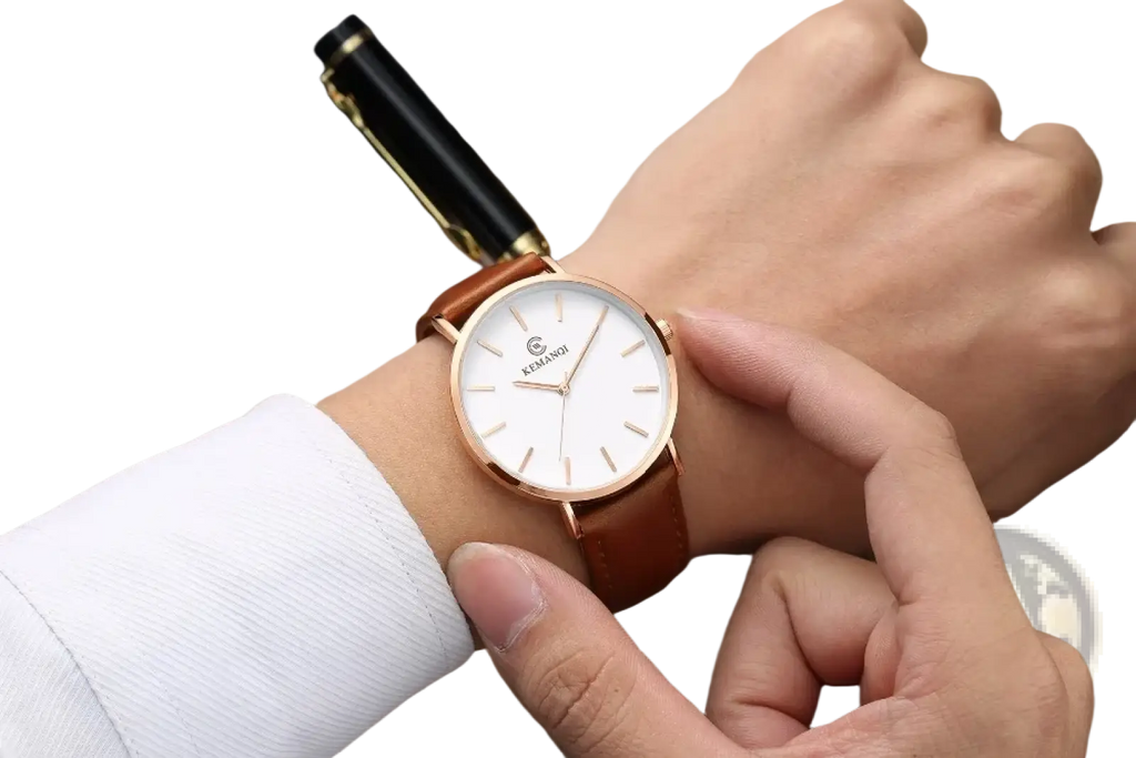 Ultra thin gold mens leather quartz watch in rose gold with white dial and brown leather strap worn on wrist