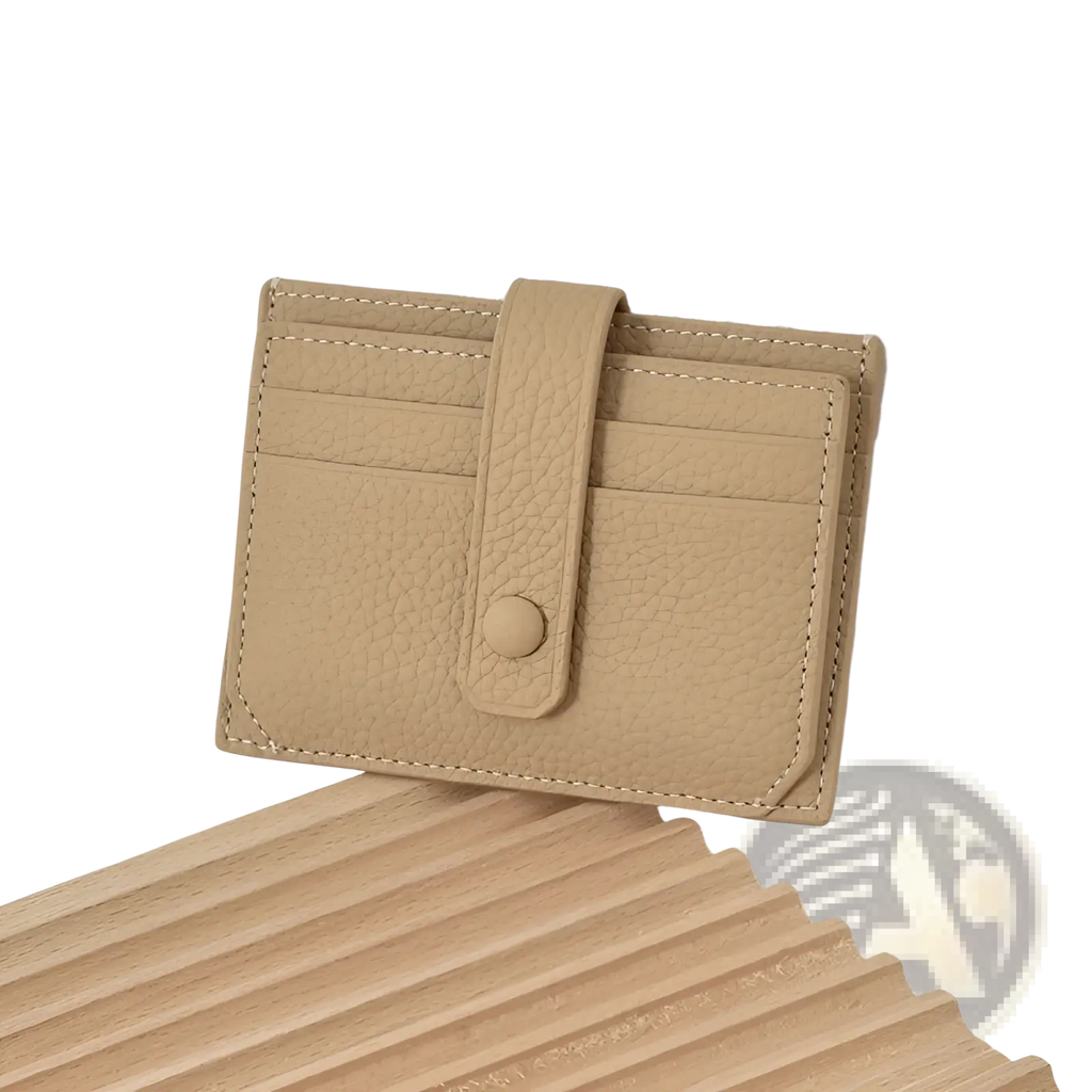 Beige ultra thin minimalist textured leather card holder with button closure, stitched edges, and strap
