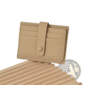 Beige ultra thin minimalist textured leather card holder with button closure, stitched edges, and strap