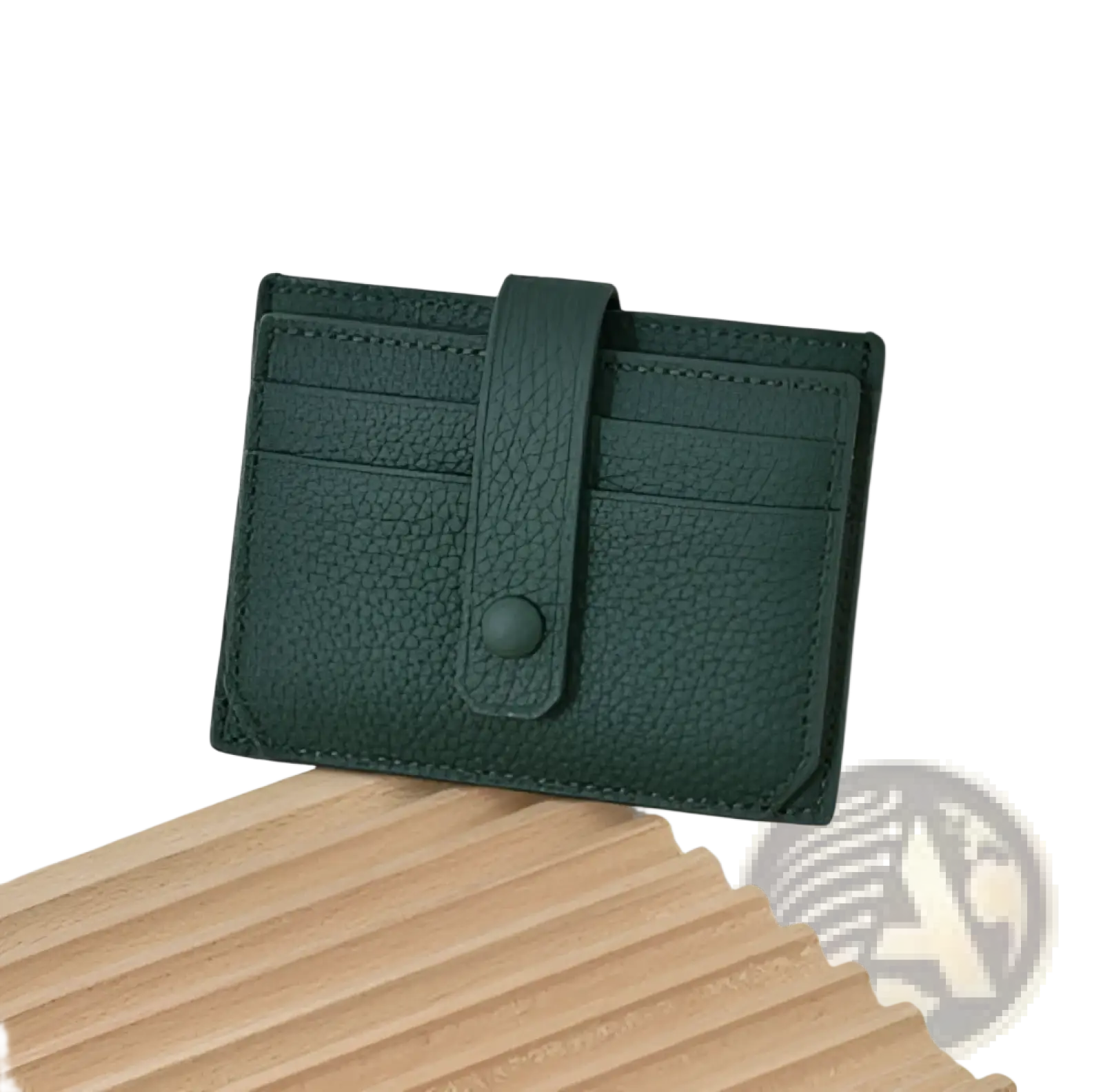 Ultra thin minimalist dark green leather card holder with textured flap closure and matching button strap