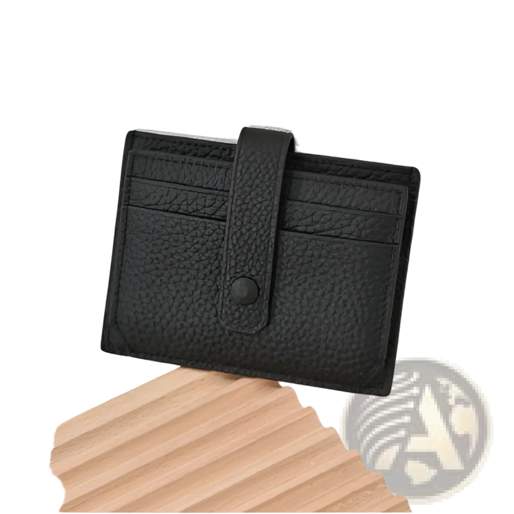 Black textured leather ultra thin minimalist card holder with a flap closure secured by a single button and strap
