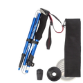 Blue aluminum ultralight folding trekking poles with black ergonomic grips and adjustable length folded next to mesh bag