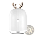 White ceramic ultrasonic deer air humidifier with gold antler accents and minimalist y logo on glowing base