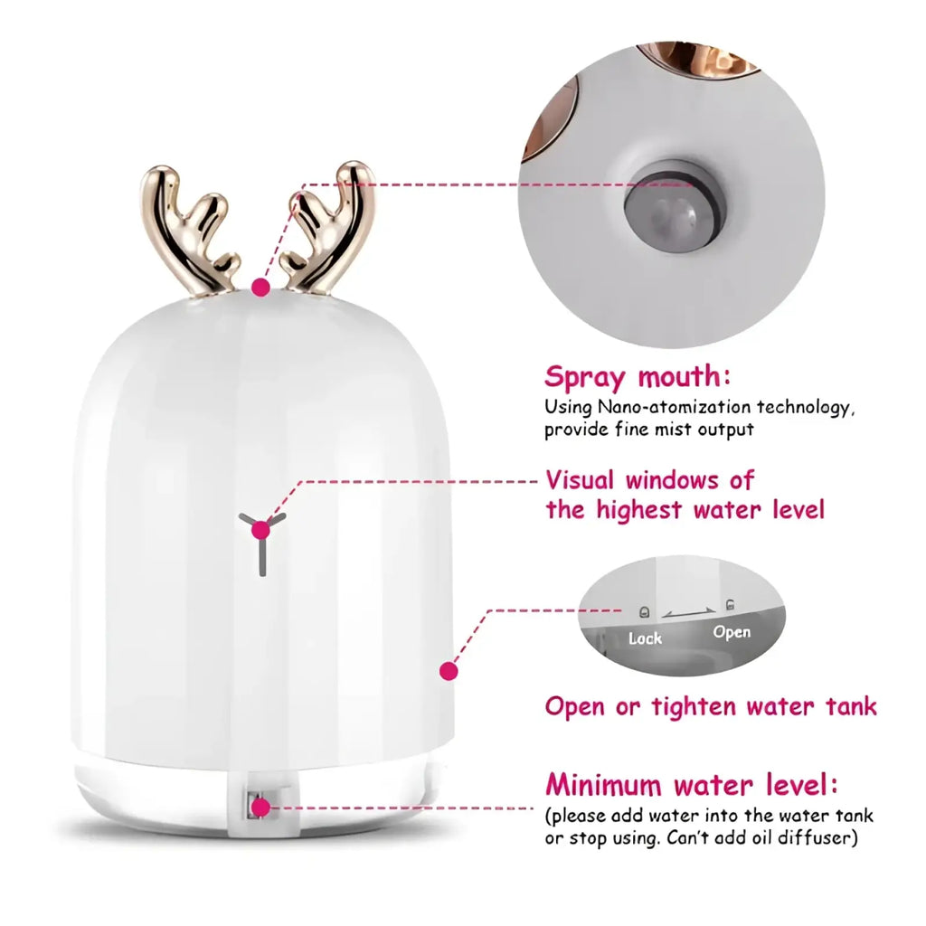 White ceramic ultrasonic deer air humidifier with gold antlers glowing base and spray mouth for room use