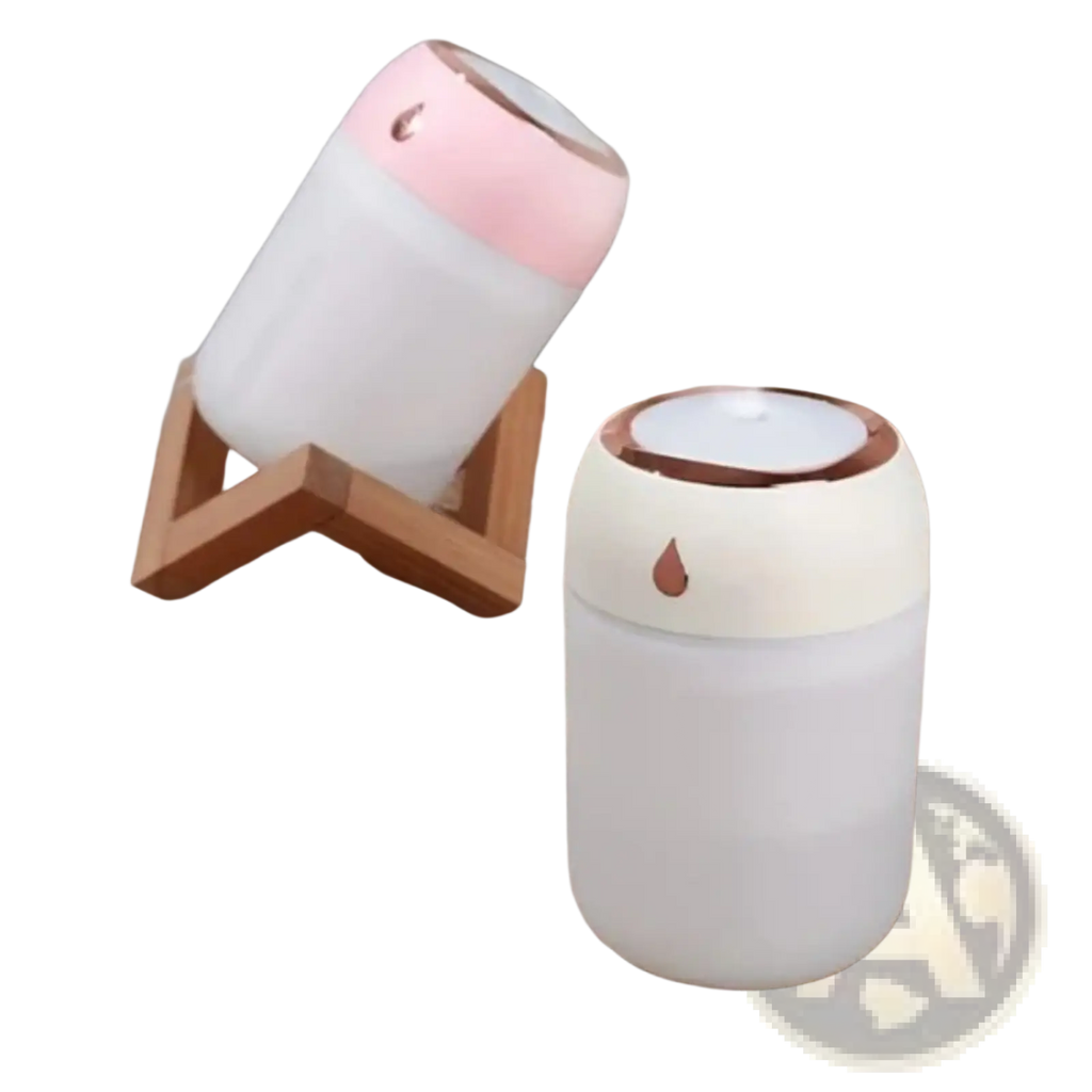 Ultrasonic usb desktop humidifier with night light in white and pink featuring a droplet design on the lid