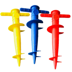 Three brightly colored plastic spiral garden stakes with cross handles for umbrella base use on sand ground and sun beach