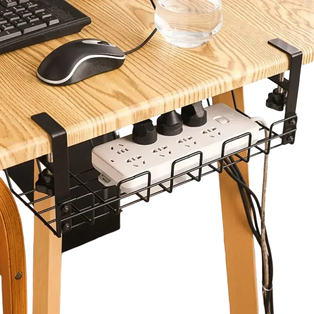 Black metal desk caddy holding a white power strip for under desk cable management and wire organization