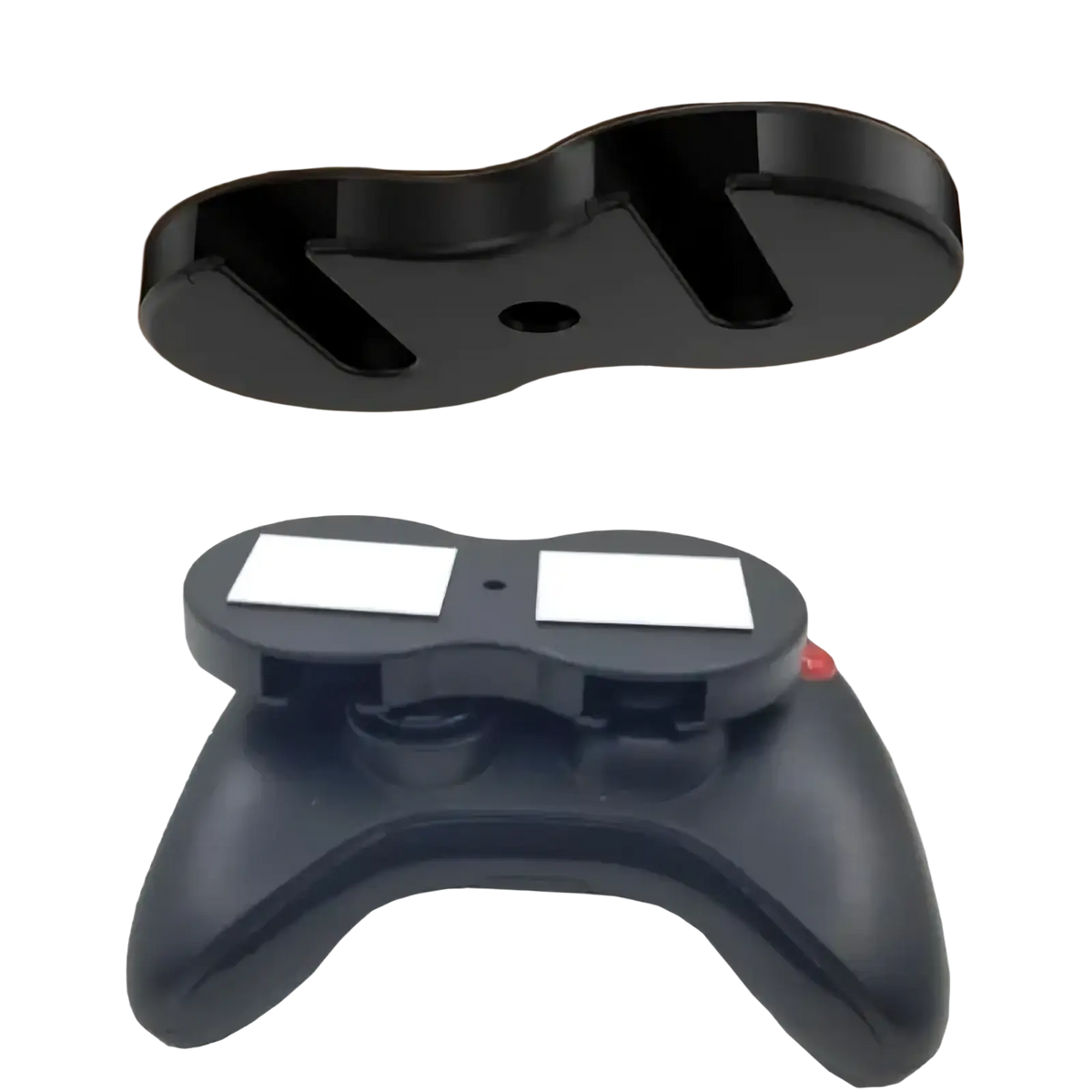 Black plastic under desk game controller mount holder with two white magnetic pads for secure attachment