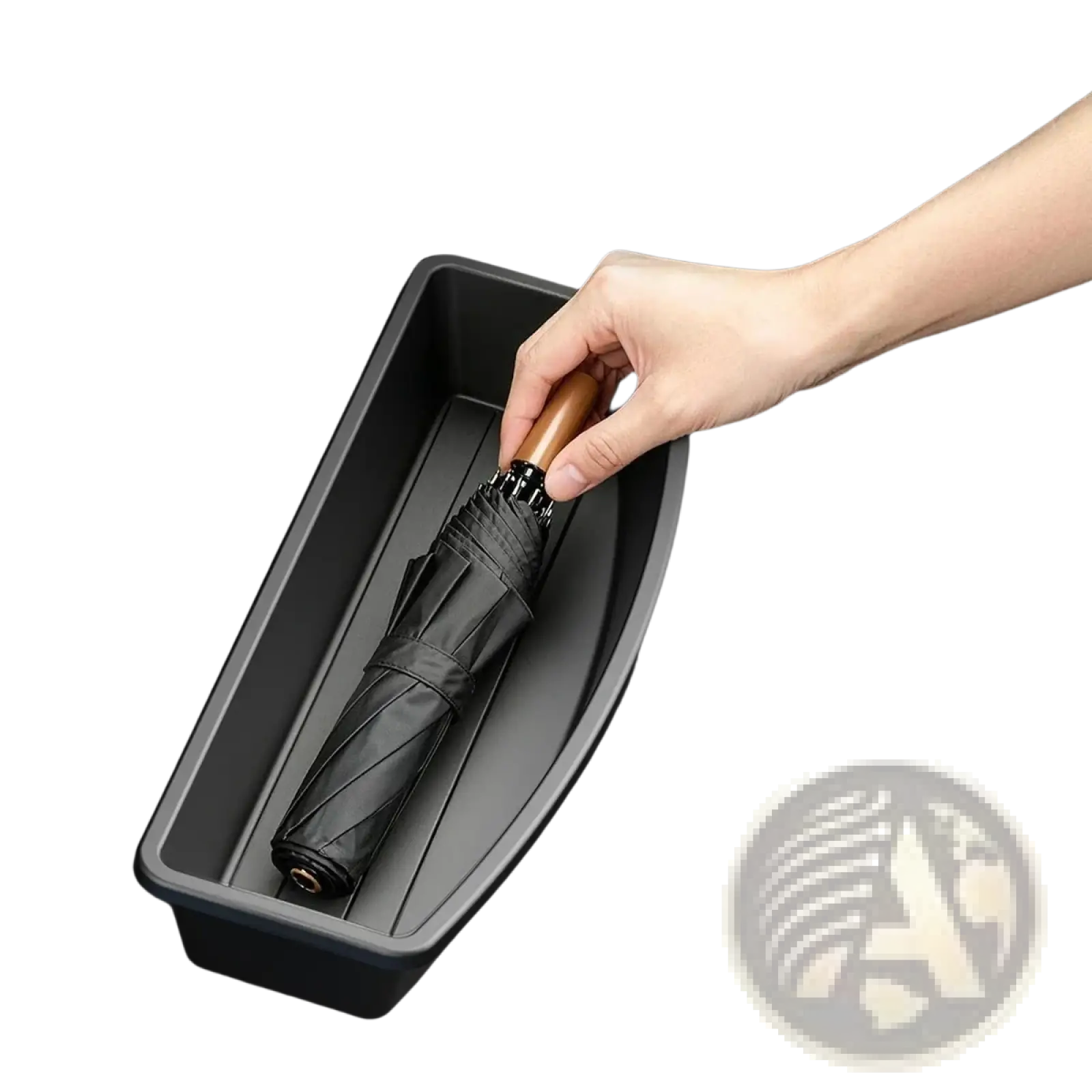 Under seat car storage organizer box holding a neatly folded black umbrella with wooden handle in a black tray