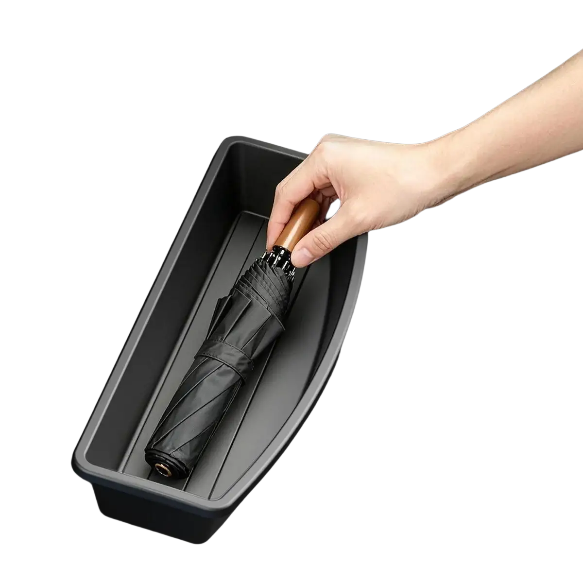 Under seat car storage organizer box holding a neatly folded black umbrella with wooden handle in a black tray