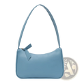 Underarm shoulder bag faux leather rectangular purse in soft light blue with curved top and matching fabric bow zipper pull