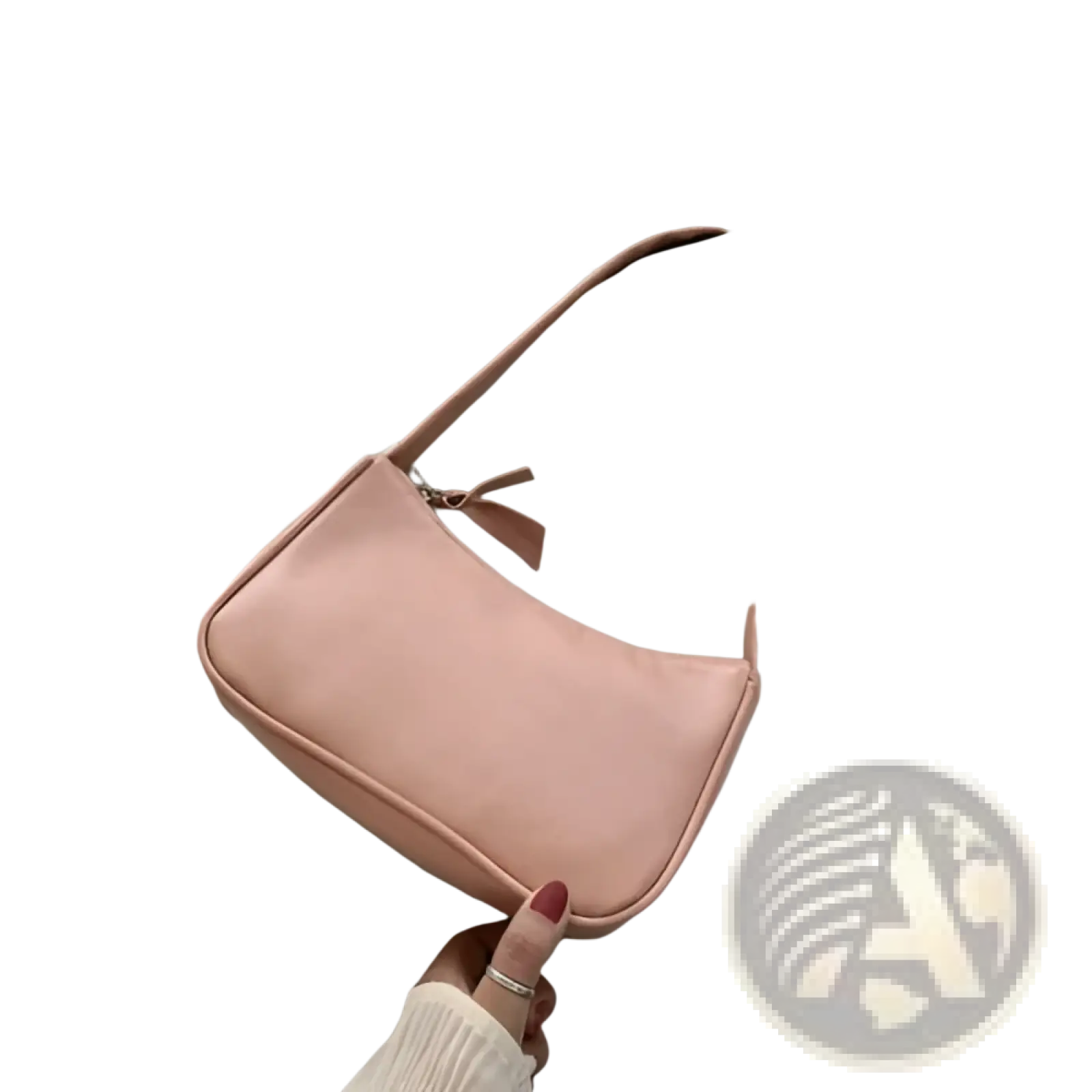 A soft pink underarm shoulder bag made of faux leather with a sleek rectangular design and matching strap