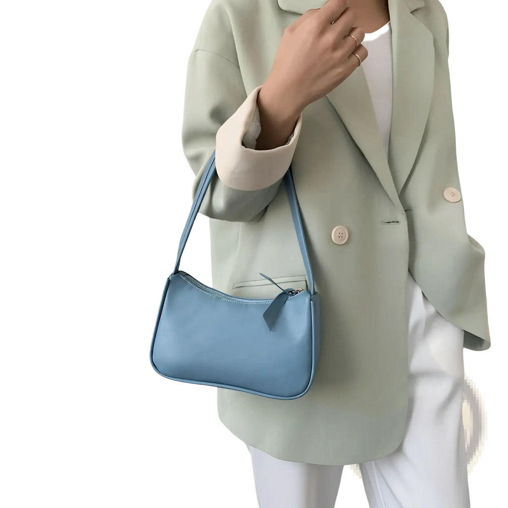 Underarm shoulder bag faux leather rectangular purse in light blue with a sleek curved design and matching strap