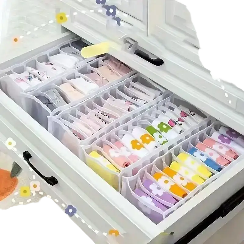 Clear plastic underwear organizer drawer divider with colorful patterned socks neatly arranged in compartments
