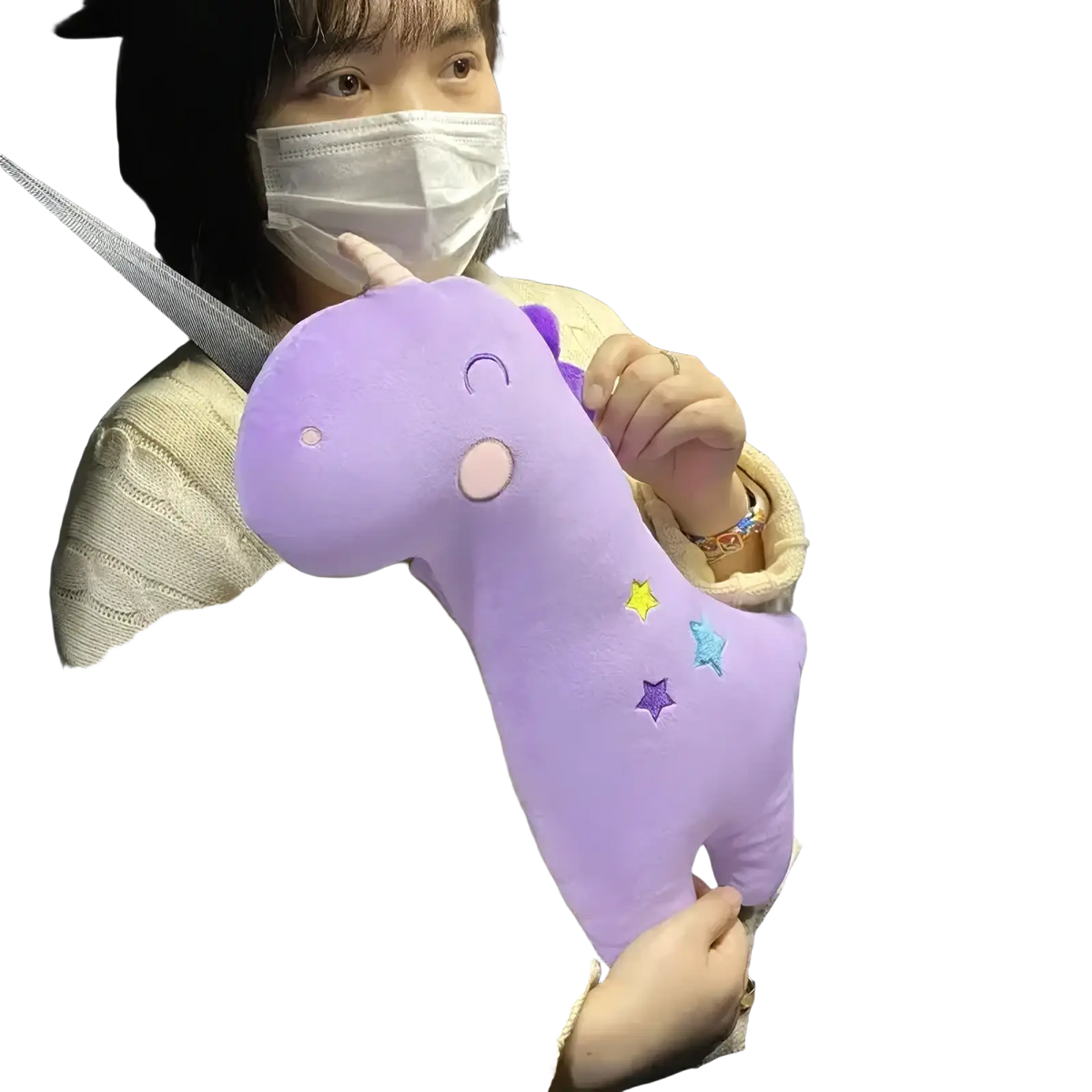 Purple plush unicorn car seat belt pillow for kids with embroidered stars and a smiling face design