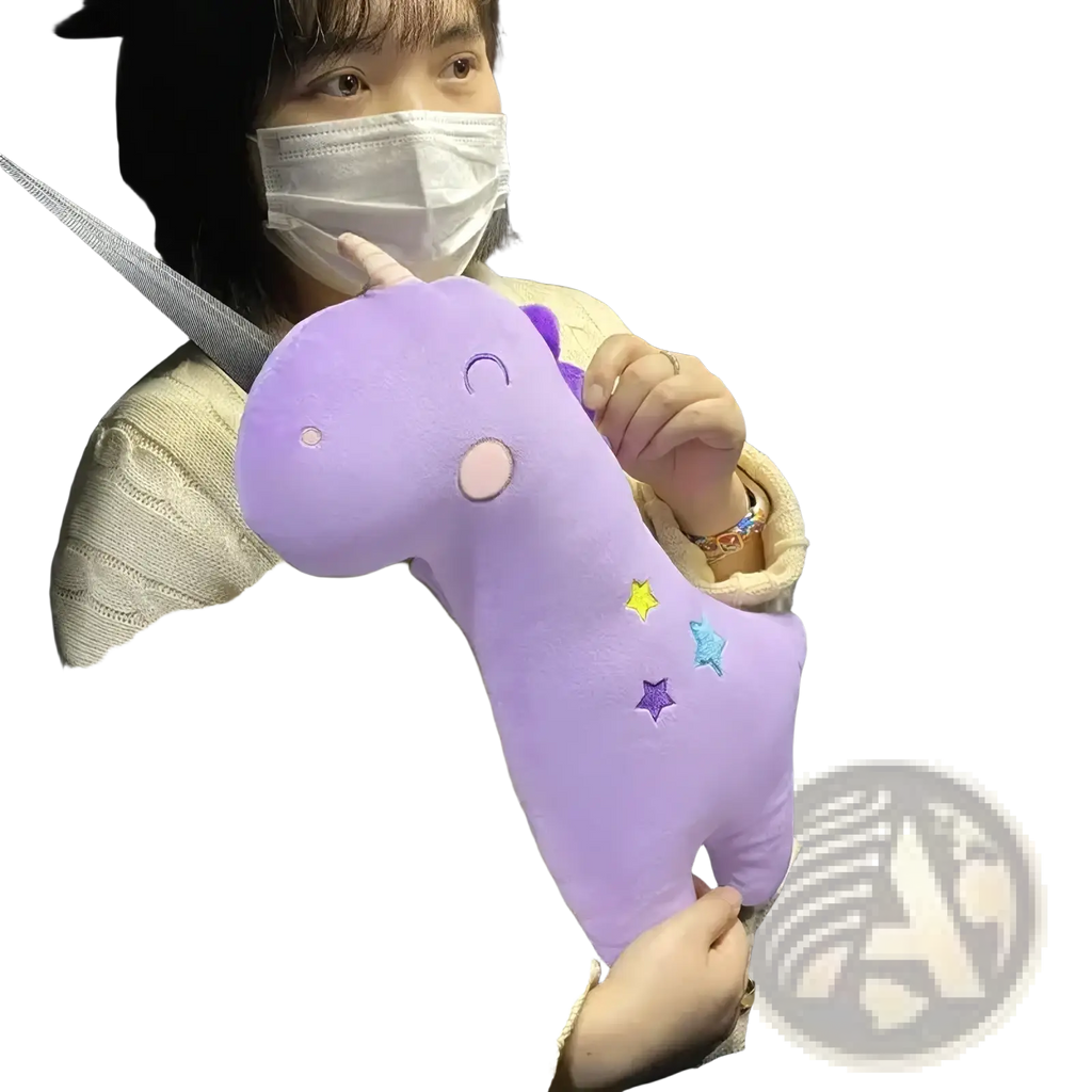 Purple plush unicorn car seat belt pillow for kids with embroidered stars and a smiling face design
