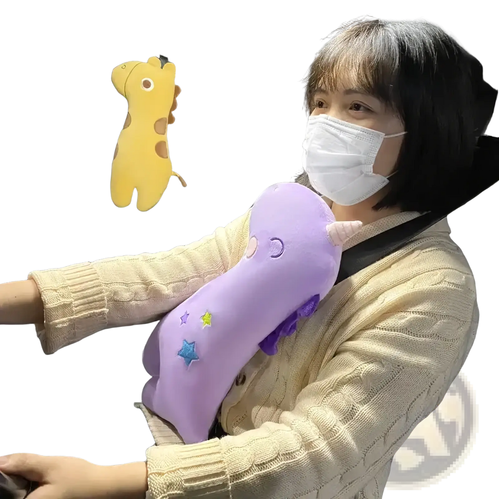 Purple plush unicorn car seat belt pillow for kids with embroidered stars and a small horn for comfort and support