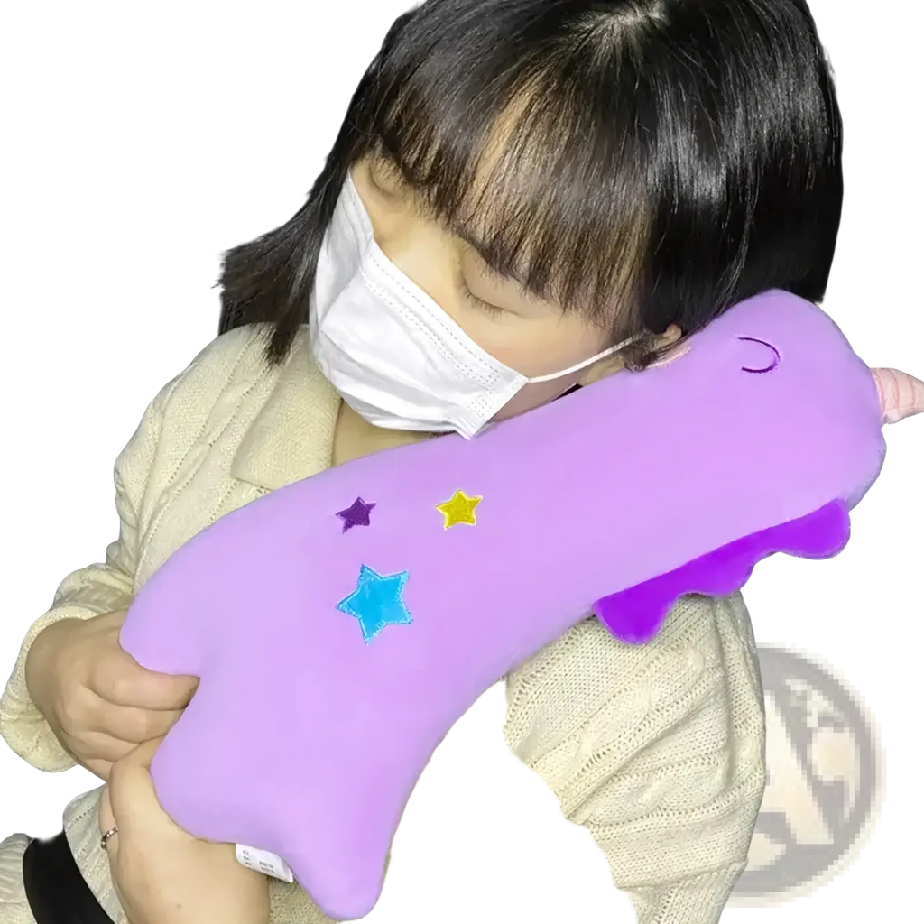 Purple plush unicorn-shaped neck pillow with embroidered stars and pink horn designed as a car seat belt pillow for kids