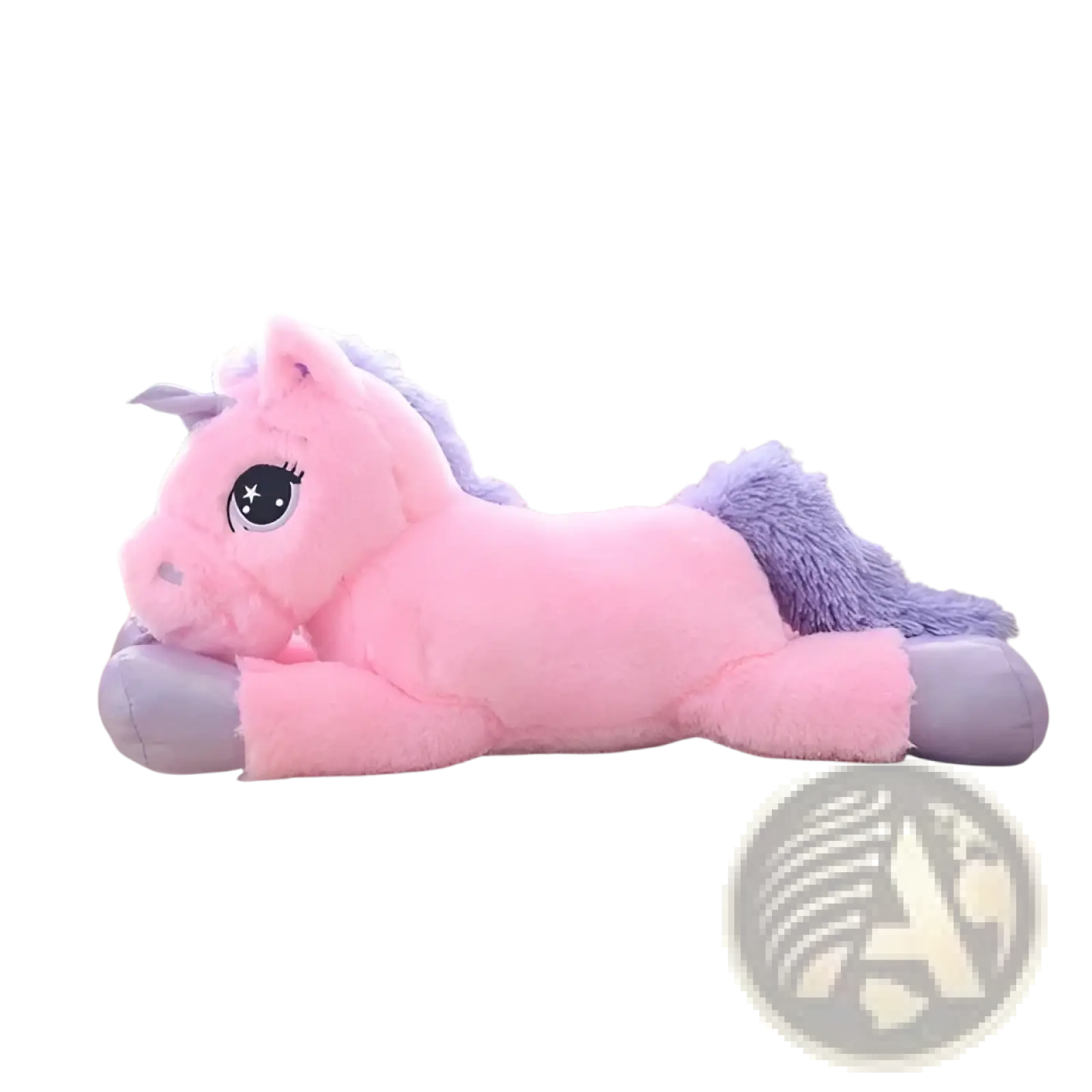 Pink plush unicorn toy with purple mane and tail lying on a couch soft pink and purple stuffed animal