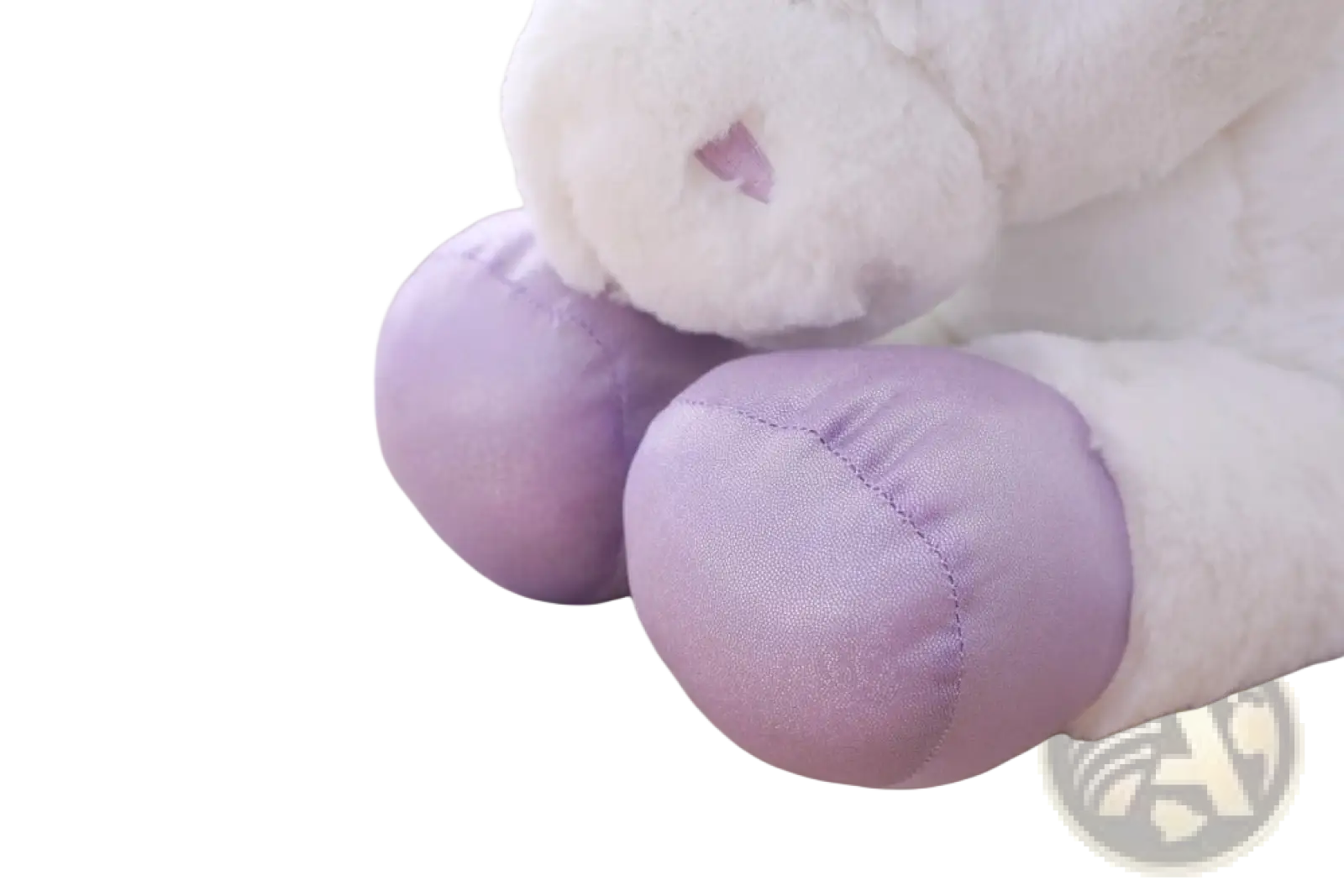 A unicorn plush toy with soft white fur and lavender hooves in pink and purple soft stuffed animal design