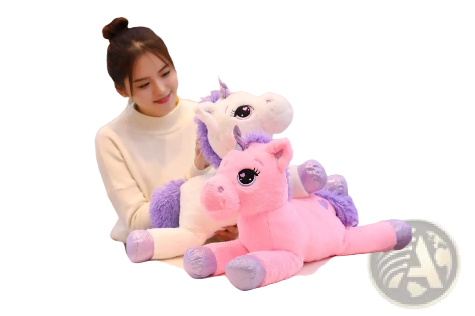 Pink plush unicorn toy with purple mane and hooves sitting on a table soft stuffed animal for kids