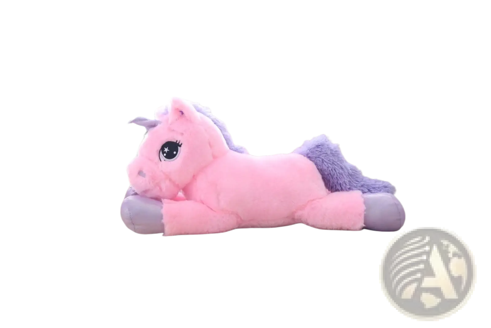 Pink plush unicorn toy with purple mane and tail lying on a couch soft stuffed animal for kids