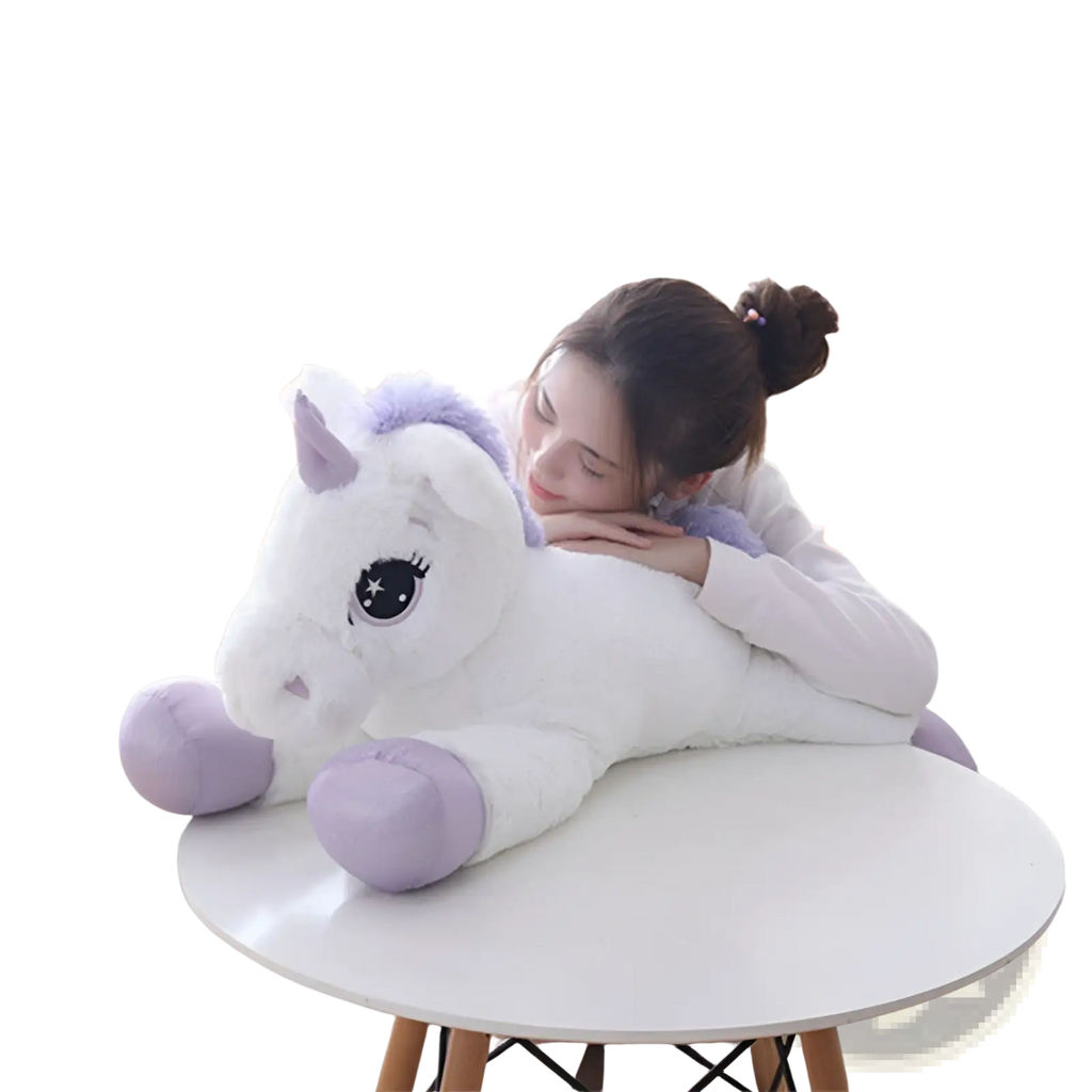 A plush white unicorn toy with lavender accents and large eyes resting on a round table soft pink and purple stuffed animal